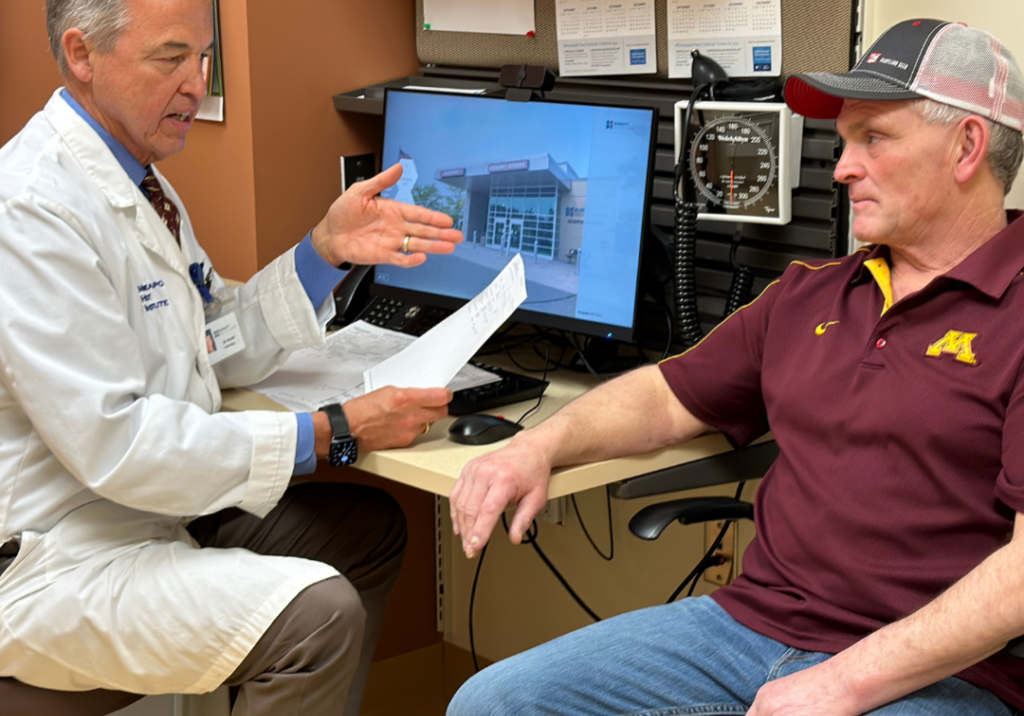 Doctor discussing health concerns with a patient in a medical office, emphasizing personalized preventive care at Burnett Medical Center.
